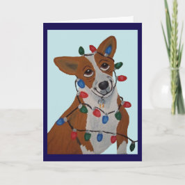 Tarjeta Corgi enredado en luces de Navidad
