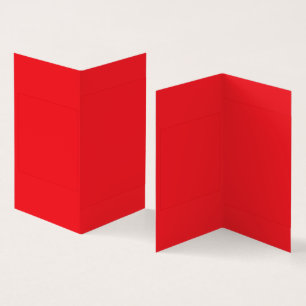 Tarjeta Crayones rojos y naranjas que yacen uno al lado de