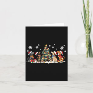 Tarjeta Cute Dachshund Santa Hat Árbol de navidad ilumina