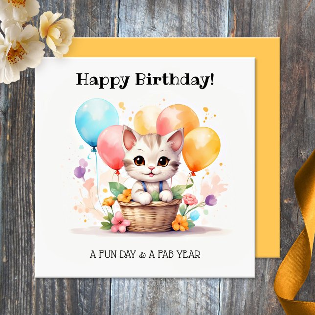 Tarjeta Cute Kitty con globos Feliz cumpleaños (Birthday card featuring a cut kitten in a basket with colorful balloons. Nice for a cat loving girl)