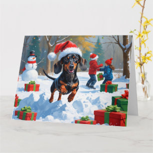 Tarjeta Dachshund corriendo en la nieve con sombrero de Na