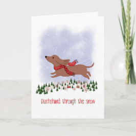 Tarjeta Dachshund de Navidad a través de la nieve