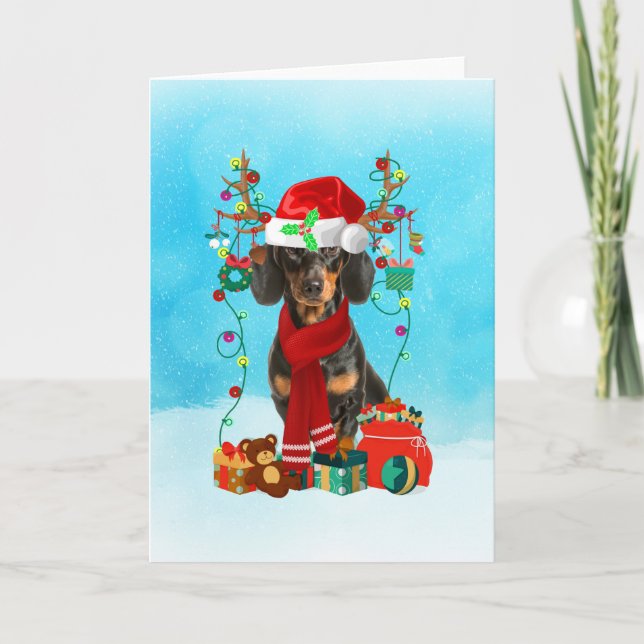 Tarjeta Dachshund en la nieve con regalos de Navidad (Anverso)