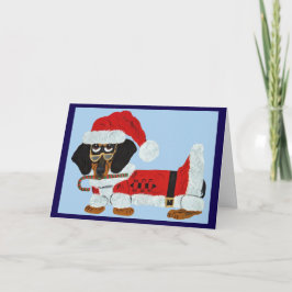 Tarjeta Dachshund negro y marrón de Santa con un bastón de