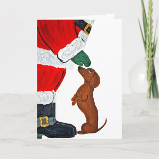 Tarjeta Dachshund recibiendo una mascota de Santa