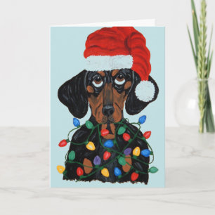 Tarjeta Dachshund Santa enredado en luces de Navidad