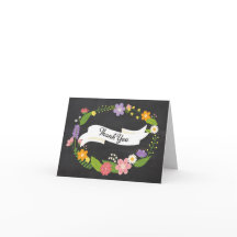 Corona de bosque bohemio en pizarra de boda