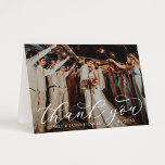 Tarjeta De Agradecimiento Elegant Calligraphy Custom Wedding Photo<br><div class="desc">Folded horizontal wedding thank you cards feature an elegant and stylish white calligraphy script text overlay design. Personalize the front with a favorite photo of the bride and groom, as well as a simple sans serif monogram of the couple's names. The back includes a second photo and a custom thank...</div>