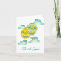 Globos de aire caliente de amarillo y agua gracias