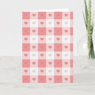 Tarjeta de amor a cuadros con corazón rosa