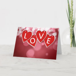 Tarjeta de amor para los corazones rojos
