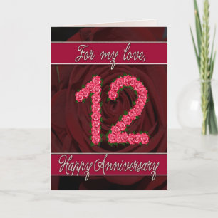 tarjeta de aniversario número 12 con rosas y hojas