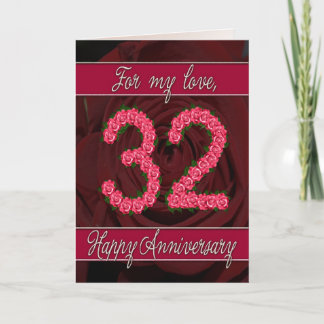 tarjeta de aniversario número 32 con rosas y hojas