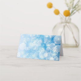 Tarjeta De Asiento Navidades con copos de nieve en un fondo azul