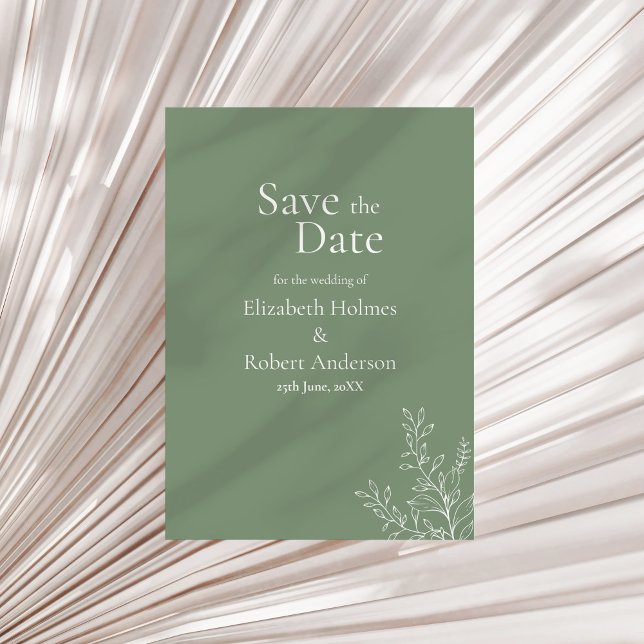 Tarjeta de aviso de salvia verde oscuro botánico (Dark Sage Green Botanical Save the Date Invitation on a neutral dry palm leaf.)