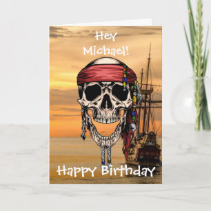 Tarjeta de barco al atardecer con calavera pirata