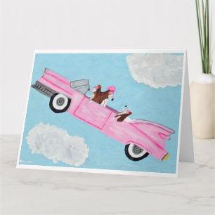 Tarjeta de Basset Hound en convertible rosa en el