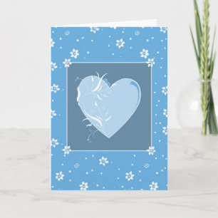 Tarjeta de corazón azul y flores