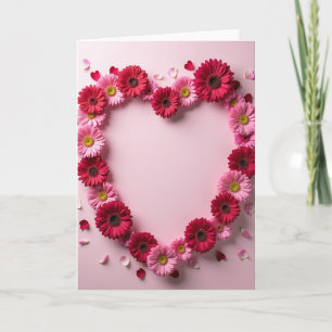 Tarjeta de corazón con flores rosadas y rojas