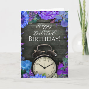 Tarjeta de cumpleaños atrasado con reloj floral rú