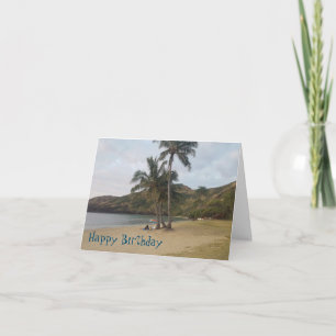 Tarjeta de cumpleaños con escena en la playa.
