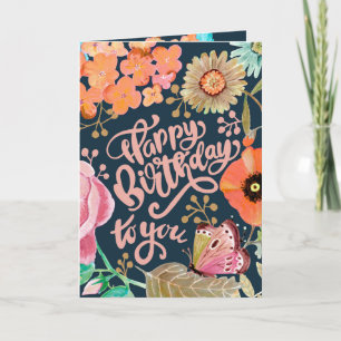 Tarjeta de cumpleaños con flores y letras