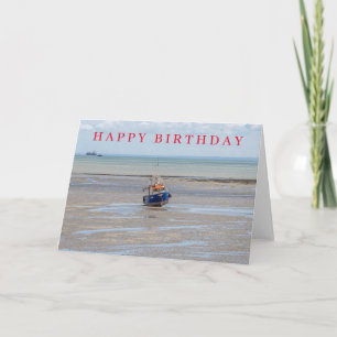 Tarjeta de cumpleaños de barco azul en marea baja