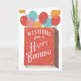 Tarjeta de cumpleaños de globos de colores y una c