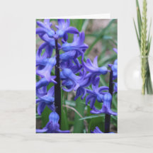 Tarjeta de felicitación con flores moradas y poema