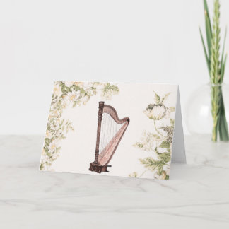 Tarjeta de felicitación de la arpa y de las flores