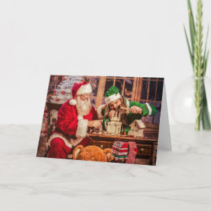 Tarjeta de felicitación del navidad con Santa y el