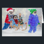 Tarjeta de felicitación Kittens Winter Wonderland<br><div class="desc">La nieve está cayendo,  nuestros gatitos están apiñados y trayendo a casa un árbol con una decoración brillante. Es hora de divertirse en vacaciones,  ya que el hermano pequeño disfruta montando el trineo.</div>
