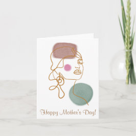 Tarjeta de felicitación plegada a la cara con esti