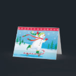 Tarjeta de felicitación Snowman Skateboarding<br><div class="desc">Snowman Skateboarding en una caña de caramelo con tarjeta de saludo de nieve en invierno</div>