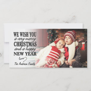 Tarjeta de foto completa de la navidad con las man