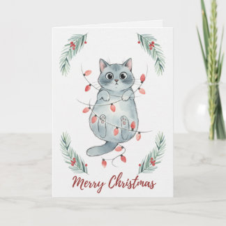 Tarjeta de gatito de Navidad enredado en luces