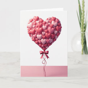 Tarjeta de globo de corazones rosados de amor