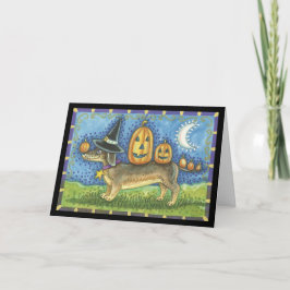 Tarjeta de Halloween con perro y calabazas brujas
