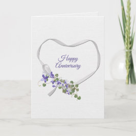 Tarjeta de la cinta del aniversario con flores