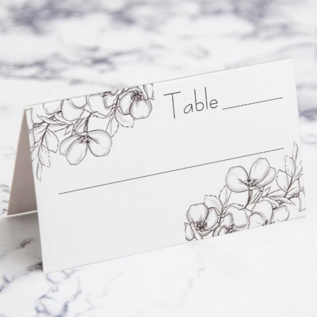 Tarjeta de lugar plegado de línea floral blanca y  (wedding table escort placard with white and black floral line art)