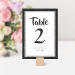 Tarjeta De Mesa Bat Mitzvah Purpurinoso Negro y Plata<br><div class="desc">Este número de mesa de moda de Bat Mitzvah presenta un purpurina falso brillante sobre un fondo de color sólido. Utilice el formulario de plantilla para agregar su propia información. La Herramienta de diseño se puede utilizar para cambiar el estilo de fuente,  el color y el diseño.</div>
