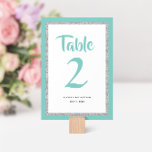 Tarjeta De Mesa Bat Mitzvah Purpurinoso Verde azulado y plateado<br><div class="desc">Este número de mesa de moda de Bat Mitzvah presenta un purpurina falso brillante sobre un fondo de color sólido. Utilice el formulario de plantilla para agregar su propia información. La Herramienta de diseño se puede utilizar para cambiar el estilo de fuente,  el color y el diseño.</div>