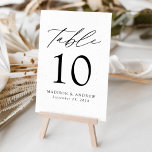Tarjeta De Mesa Boda de Elegancia Moderna Específico Blanco y Negr<br><div class="desc">Tarjetas de números de tabla minimalistas y modernas con letras modernas de color negro con "Table" en escritura moderna de caligrafía. El diseño presenta un fondo blanco con sutiles puntas negras para un diseño único. El diseño se repite en la parte posterior. Para solicitar las tarjetas de tabla: agregue su...</div>