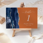 Tarjeta De Mesa Boda de Naranja quemado con sabor a plata azul de<br><div class="desc">El borde izquierdo de esta elegante y moderna tarjeta boda número de mesa cuenta con un borde de batida color azul marino recortado con un falso purpurina plateado. El texto del personalizable combina la escritura a mano gris plateado,  las fuentes cursiva y de copperplate en un fondo naranja quemado.</div>
