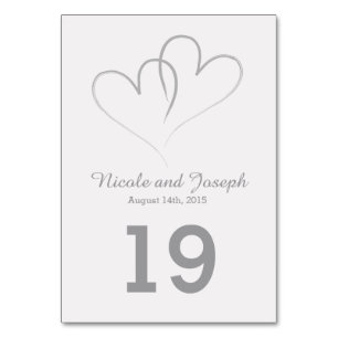 Tarjeta de mesa boda - Dos corazones plateados ent