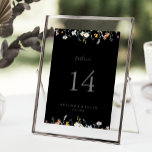 Tarjeta De Mesa Boda negro floral multicolor salvaje<br><div class="desc">Este número de la mesa de boda floral multicolor es perfecto para un boda rústico. El diseño se compone de acuarelas rosas, rubias, violetas, navales y elegantes flores blancas con hojas de color verde esmeralda en un fondo oscuro. Este es un número de tabla de doble cara. Agregue cada número...</div>