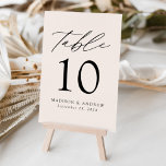 Tarjeta De Mesa Cream Modern Elegance Wedding<br><div class="desc">Trendy, minimalist wedding table number cards featuring black modern lettering with "Table" in modern calligraphy script. The design features a creamy beige background or a color of your choice. The design repeats on the back. To order the table cards: add your name, wedding date, and table number. Add each number...</div>