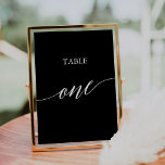 Tarjeta De Mesa Elegante blanco sobre la tabla de caligrafía negra<br><div class="desc">Este elegante blanco sobre la mesa de caligrafía negra un número de mesa es perfecto para un simple boda. El diseño neutro cuenta con una tarjeta minimalista decorada con una tipografía romántica y caprichosa. La tarjeta se imprime en la parte delantera y trasera (doble cara). Otros números de tabla de...</div>