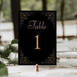 Tarjeta De Mesa Elegante Boda de oro negro de follaje vintage<br><div class="desc">Esta elegante tarjeta de mesa boda de inspiración vintage presenta un delicado borde botánico dorado sobre un fondo negro. La palabra "tabla" aparece en un guión de color dorado,  con el número editable a continuación en el tipo de letra del serif dorado.</div>