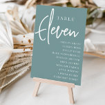 Tarjeta De Mesa ELEVEN DE tabla con guiones manuales   nombres de<br><div class="desc">Las tarjetas de número de tabla simples y de moda en blanco y verde azulado polvoriento hacen una declaración elegante en su boda o evento. Las funciones de diseño "table [number]" se encuentran en una mezcla impresionante de letras clásicas de sif y manuscritas, con nombres de invitados individuales debajo. El...</div>